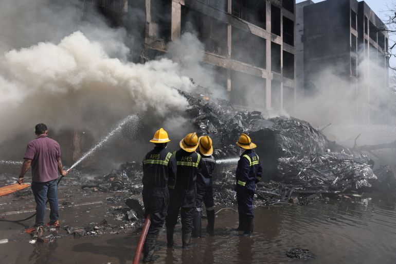 reuters_694b2824-1766533156 FILE PHOTO: Firefighters work to put out a fire at the site where an Air India plane crashed in Ahmedabad, India, June 12, 2025. REUTERS/Amit Dave/File Photo
