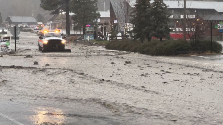 A vehicle moves through a flooded street during torrential rains, in San Bernardino County, California, U.S. December 24, 2025, in this screengrab obtained from a social media video. Damian Nikodem/via REUTERS THIS IMAGE HAS BEEN SUPPLIED BY A THIRD PARTY. MANDATORY CREDIT. NO RESALES. NO ARCHIVES. VERIFICATION LINES: - Reuters was able to verify the location and date of the video from original file metadata from the source. - The buildings, road layout and business signages matched file imagery of the area.