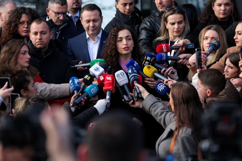 President of Kosovo Vjosa Osmani, flanked by her husband Prindon Sadriu, speaks to the members of the media, on the day of a snap parliamentary election, nearly a year after a political deadlock that prevented the formation of a new government, in Pristina, Kosovo, December 28, 2025. REUTERS/Valdrin Xhemaj