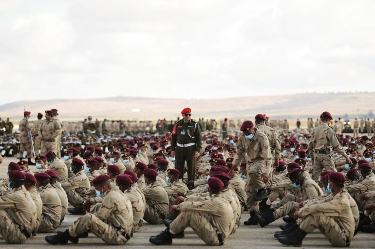 rtx8i5sq Soldiers loyal to Libyan military commander Khalifa Haftar take part in Independence Day celebrations in Benghazi