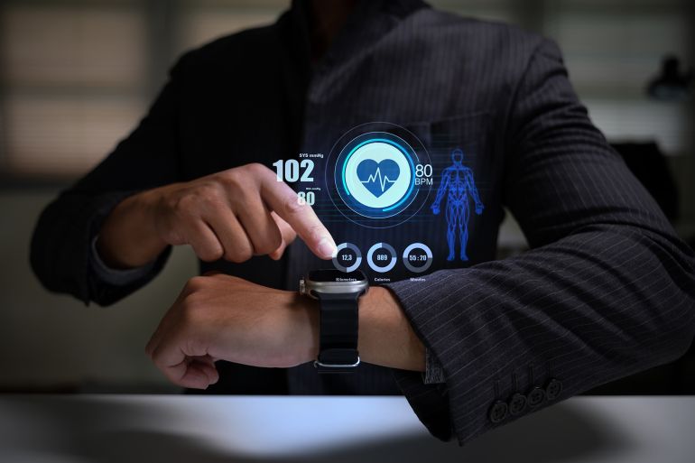 Digital health monitoring technology concept with wearable device tracking vital signs and performance.; Shutterstock ID 2681502095; purchase_order: aj; job: ; client: ; other: