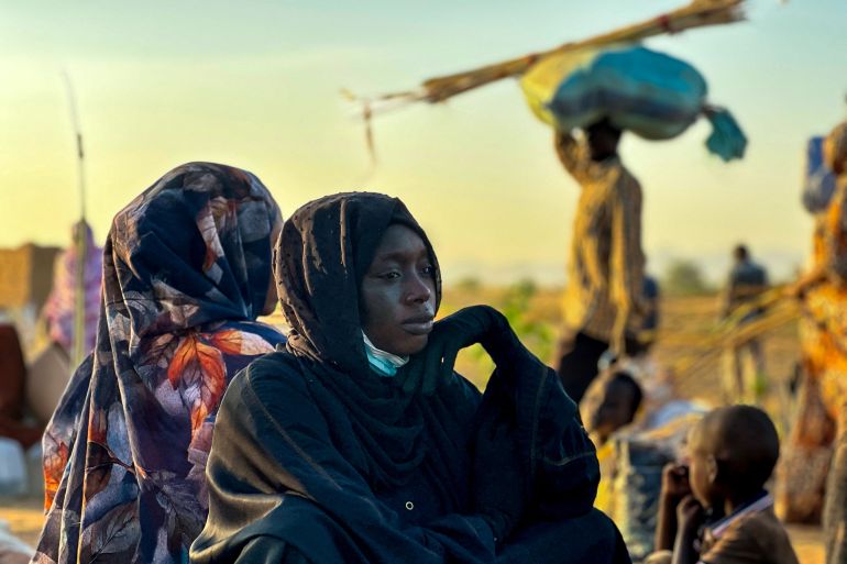 su-1766611718-1 A displaced woman rests in Tawila, in the country's war-torn western Darfur region, on October 28, 2025, after fleeing El-Fasher following the city’s fall to the Rapid Support Forces (RSF). Fears mounted in Sudan on October 28, three days after paramilitaries seized the key city of El-Fasher, amid reports of mass atrocities and the killing of five Red Crescent volunteers in Kordofan. The capture of El-Fasher, the historic heart of Darfur, has sparked fears of mass killings reminiscent of the region’s darkest days. (Photo by AFP)