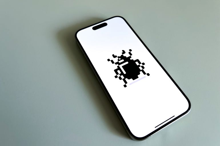 Berlin, Germany - August 31, 2024: Apple iPhone 15 Pro smartphone displaying a pixel art of a software bug.; Shutterstock ID 2513878313; purchase_order: ث; job: ; client: ; other: