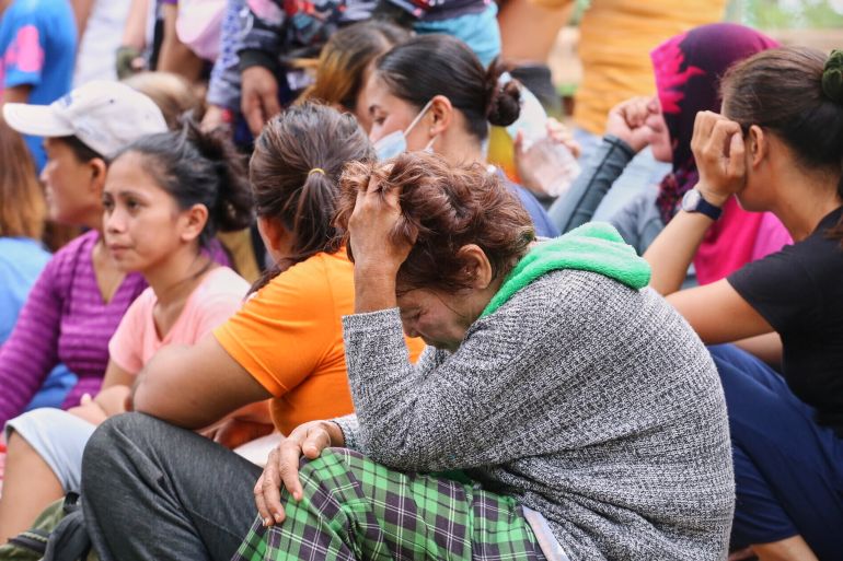 1phill-1767937714 Relatives and others wait for updates after a huge mound of garbage collapsed at a waste segregation facility in Binaliw, Cebu city on Friday, Jan. 9, 2026. (AP Photo/Jacqueline Hernandez)