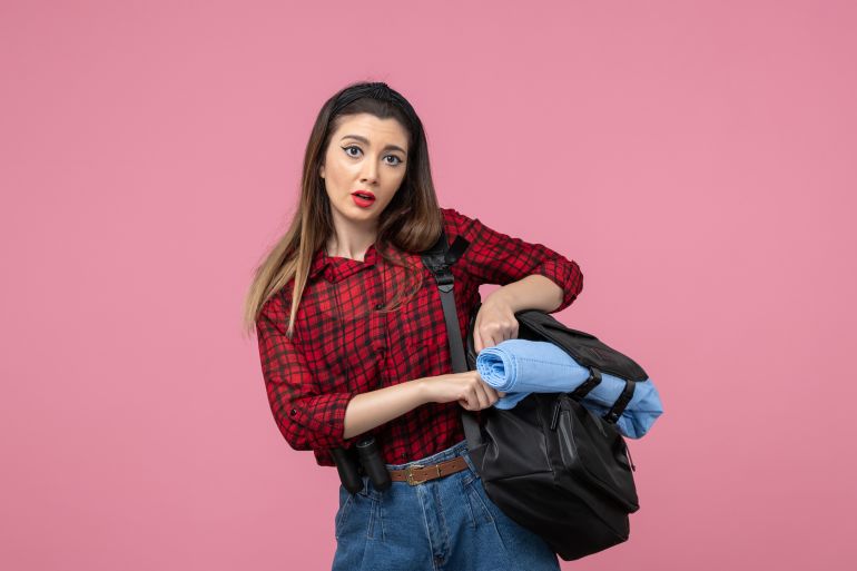 357-1769612267 Front view young female in red shirt with bag on the pink background woman photo model KamranAydinov