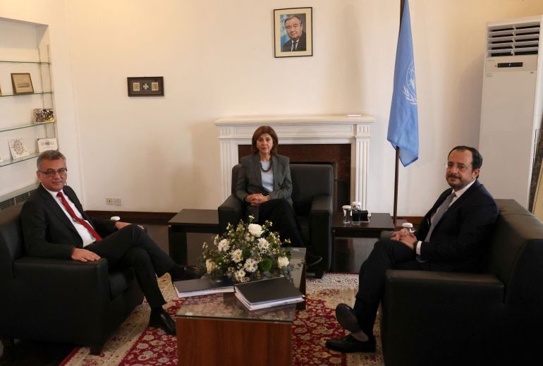 UN Cyprus envoy Maria Angela Holguin, Cyprus President Nikos Christodoulides, who leads Cyprus's Greek Cypriot community, and Turkish Cypriot leader Tufan Erhurman pose for a picture during a meeting in the UN buffer zone of the capital Nicosia, Cyprus January 28, 2026. REUTERS/Yiannis Kourtoglou