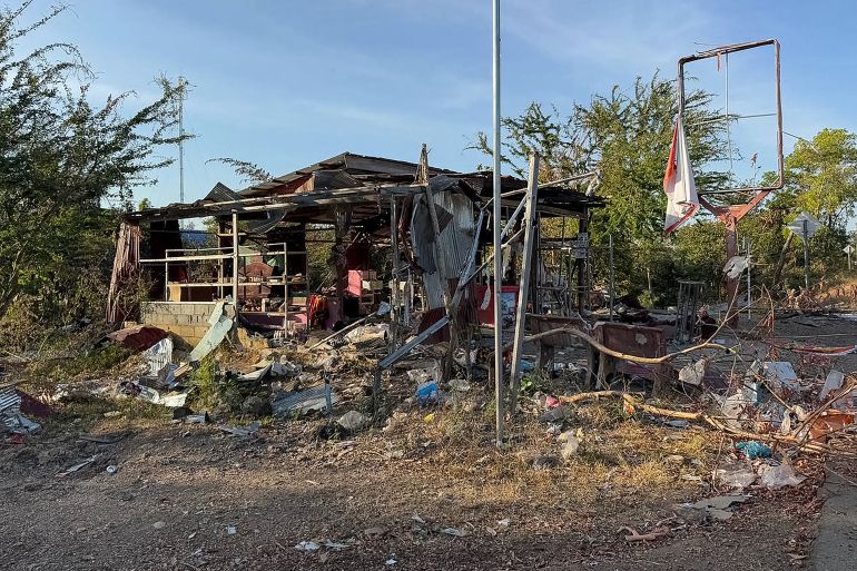 This handout photograph taken and released by Agence Kampuchea Press (AKP) on January 2, 2026 shows damaged houses following clashes between Cambodian and Thai soldiers, in Chouk Chey village in Banteay Meanchey province.