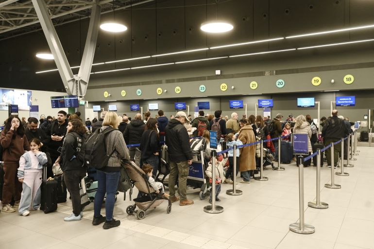 afp_695aa251947e-1767547473 Passengers wait at the Thessaloniki Airport "Makedonia" amidst disruption in flights across Greece linked to a technical problem at the Athens Flight Information Region (FIR), in Thessaloniki, on January 4, 2026.