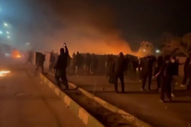 afp_69672bf240ef-1768369138 This video grab taken on January 13, 2026 from UGC images posted on social media on January 10, 2026 shows clashes in Mashhad, in northeastern Iran.