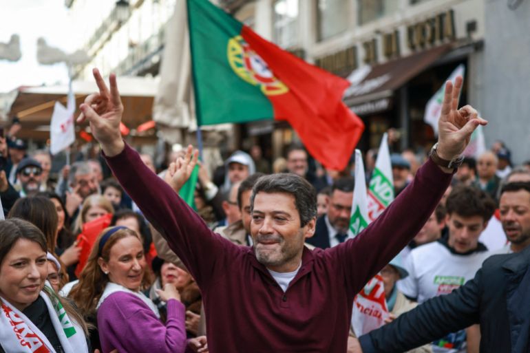 TOPSHOT - Presidential candidate of the Chega party, Andre Ventura gestures during a street rally in Lisbon on January 16, 2026.