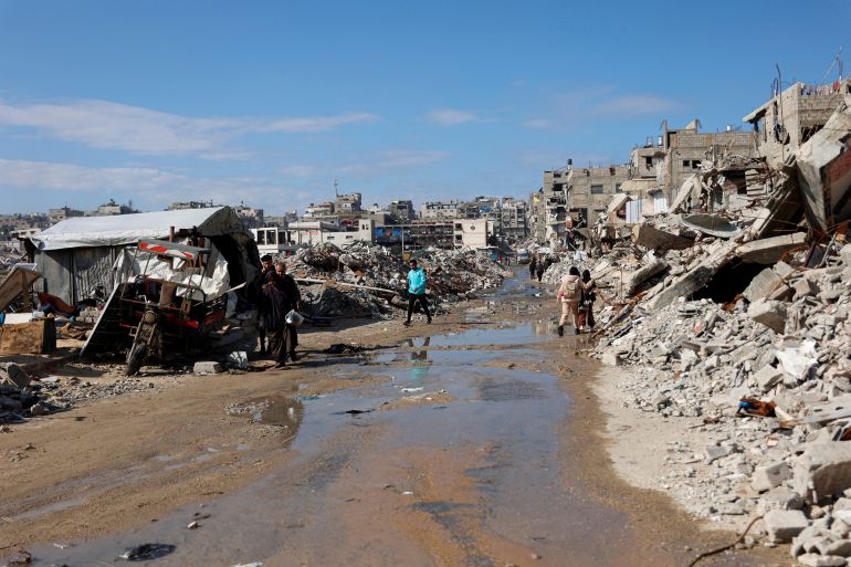 afp_696dc5179f05-1768801559-1 TOPSHOT - Displaced Palestinians live amongst the rubble and debris of homes and businesses destroyed by the Israeli military in over two years of military strikes on the Gaza Strip enclave, in Jabalia refugee camp, in the northern Gaza Strip on January 17, 2026.