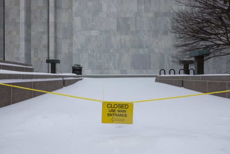 WASHINGTON, DC - JANUARY 25: A sign indicates sidewalk closure at the Library of Congress Madison Building on January 25, 2026 in Washington, DC. A massive winter storm is expected to bring frigid temperatures, ice, and snow to millions of Americans across the nation. Anna Rose Layden/Getty Images/AFP (Photo by Anna Rose Layden / GETTY IMAGES NORTH AMERICA / Getty Images via AFP)