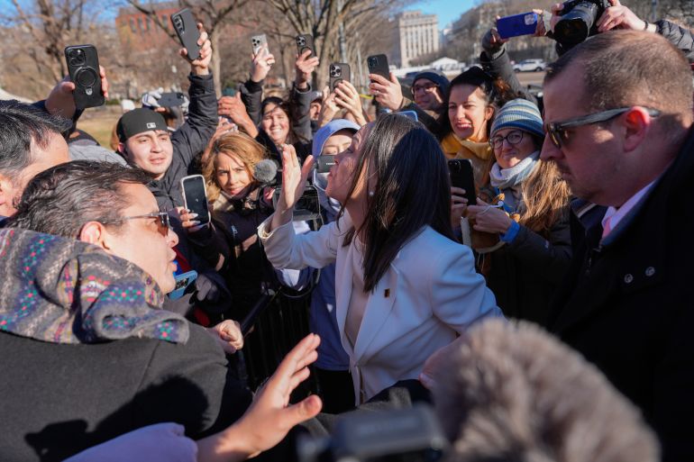 Venezuelan opposition leader María Corina Machado greets supporters on Pennsylvania Avenue near the White House after meeting with President Donald Trump Thursday, Jan. 15, 2026, in Washington. (AP Photo/Pablo Martinez Monsivais)