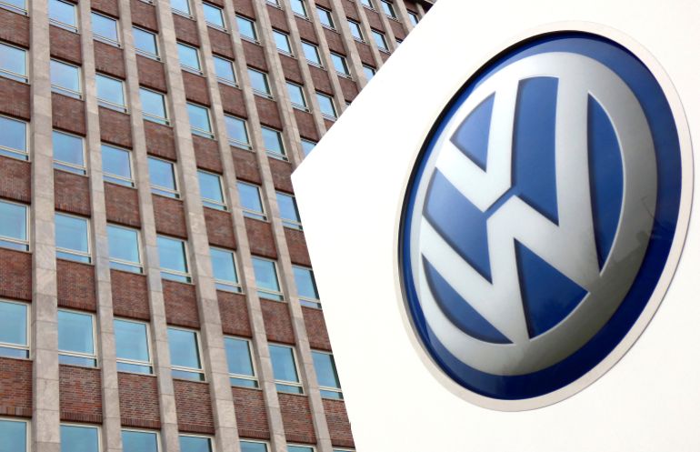 ap_697b8b321a8f2-1769704242 FILE - In this April 13, 2018 file photo, Volkswagen logo is pictured in front of a company building in Wolfsburg, Germany. (AP Photo/Michael Sohn, File)