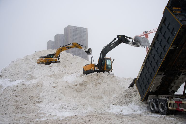 ap_697bb72436485-1769715492 Excavators are seen at a dumping site for snow cleared from the streets after heavy snowfall in Moscow, Thursday, Jan. 29, 2026. (AP Photo/Alexander Zemlianichenko)