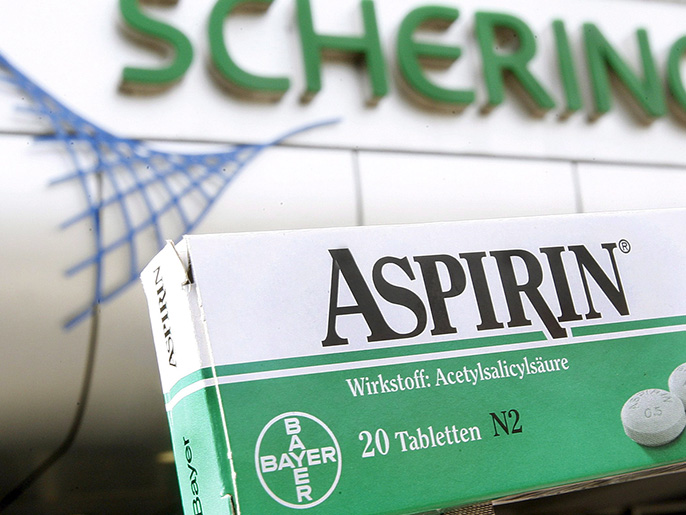 epa00676078 The picture shows a package of Aspirin pain reliever by Bayer in front of the main entrance of Schering AG in Berlin, Germany, Friday 24 March 2006. According to reports of both companies on late Thursday, 23 March 2006, the corporate group Schering and chemical big group Bayer Leverkusen surprisingly agreed on a merger. Photo: Wolfgang Kumm EPA/WOLFGANG KUMM