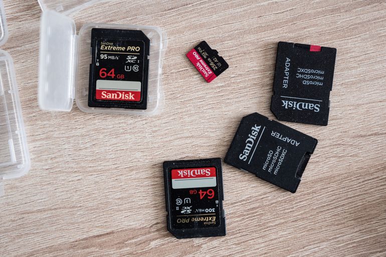 Moscow, Russia - 26 March 2021: Sandisk SD memory cards on table and microSD adapter