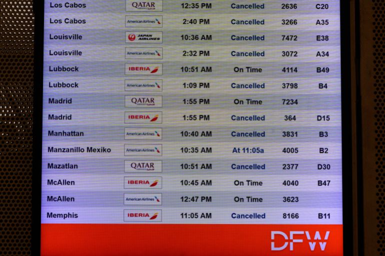 epa12678168 A view of the flight information screens displaying cancelled flight information at DFW Airport Terminal D during a winter storm in Dallas, Texas, USA, 24 January 2026. A winter storm and extreme cold watches have been issued, with cold, snow and sleet expected in North Texas. EPA/JEROME MIRON