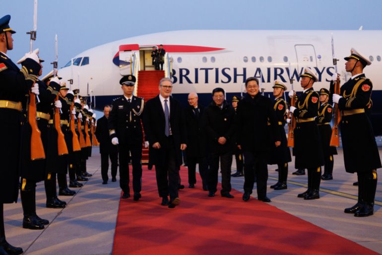epa_697b8a6fa422-1769704047 epa12686968 A handout photo made available by Number 10 Downing Street of British Prime Minister Keir Starmer (C) being greeted by a guard of honor after he arrived for a state visit to China in Beijing, China, 28 January 2026. Starmer will meet with Chinese President Xi Jinping on 29 January 2026 in Beijing. It is the first trip to China by a British prime minister since 2018. EPA/LAUREN HURLEY HANDOUT This image is for Editorial use purposes only. The Image can not be used for advertising or commercial use. The Image can not be altered in any form. All images are Crown copyright and re-usable under the Open Government Licence v3.0, except where otherwise stated. To view this licence, visit: https://www.nationalarchives.gov.uk/doc/open-government-licence/version/3/ Pictures marked as the copyright of a third party may only be re-used with permission from the rights holder.HANDOUT EDITORIAL USE ONLY/NO SALES