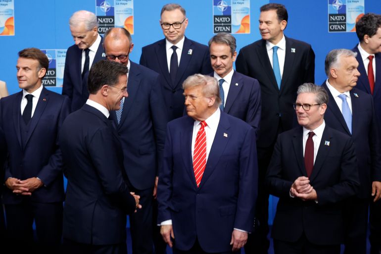 getty_694fa5f3a1-1766827507 THE HAGUE, NETHERLANDS - JUNE 25: French President Emmanuel Macron (L), NATO Secretary General Mark Rutte (3rd L), German Chancellor Friedrich Merz (4ht L), U.S. President Donald Trump (front C) and UK Prime Minister Keir Starmer (3rd R) pose with NATO heads of state and government for an official “family photo” on the second day of the 2025 NATO Summit on June 25, 2025 in The Hague, Netherlands. Among other matters, members are to approve a new defense investment plan that raises the target for defense spending to 5% of GDP. (Photo by Omar Havana/Getty Images)