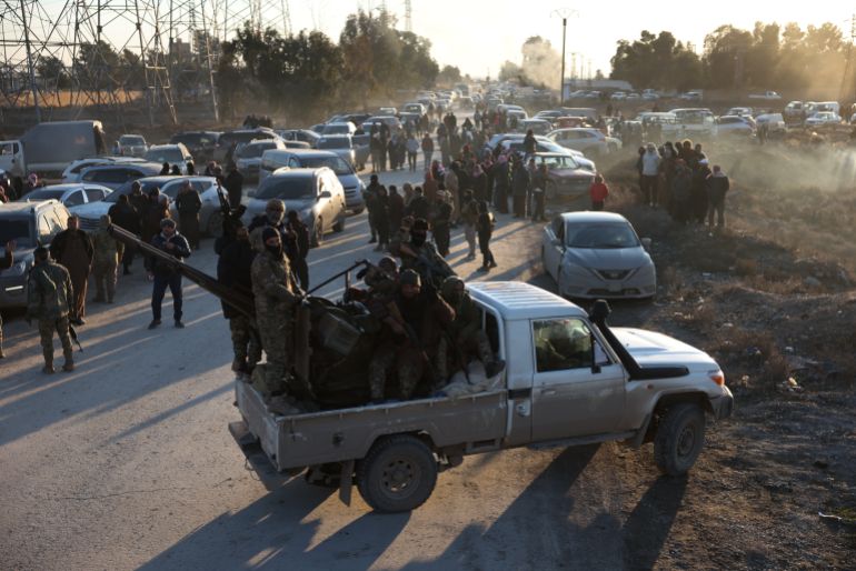 getty_696fda8142-1768938113 RAQQA, SYRIA - JANUARY 19: Syrian government forces are deployed near Al-Aqtan prison on January 19, 2026 in Raqqa, Syria. Yesterday, the Syrian government announced that a nationwide ceasefire deal had been reached with the Kurdish-led Syrian Democratic Forces (SDF), who had been clashing with government forces in recent weeks. The Kurdish-led force, a long-time ally of the United States in the fight against ISIS, had controlled large swaths of northwest Syria during the years of the country's civil war. The current ceasefire paves the way for the SDF to be integrated into Syria's military and state institutions. (Photo by Ali Haj Suleiman/Getty Images)