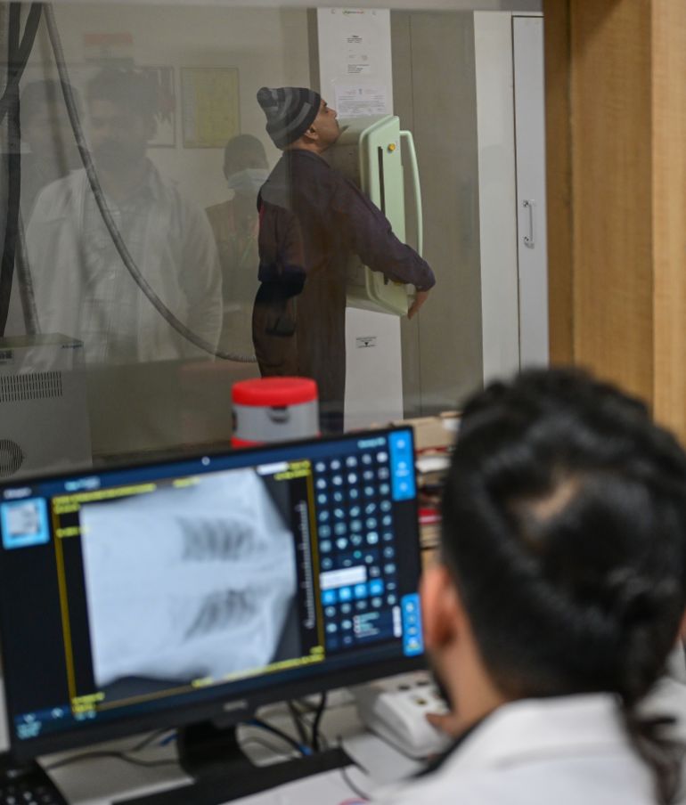 NEW DELHI, INDIA - JANUARY 10: A doctor takes a chest X-ray of a patient , suffering from respiratory problems , in NuMed Hospital , Greater Noida on January 10, 2026 in the outskirts of New Delhi, India. Presistent, record air pollution in New Delhi and the surrounding areas has led to many people suffering from respiratory problems across the city - hitting residents hard, especially those in less well-off areas. (Photo by Ritesh Shukla/Getty Images)