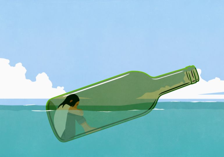 gettyimages-1309328946-1768067877 Depressed woman inside glass bottle floating in sea