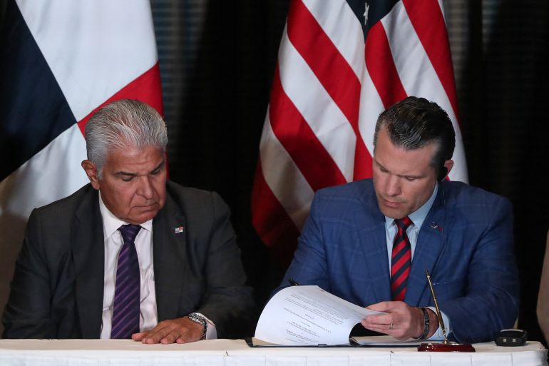 panama1-1744349458 Panama's President Jose Raul Mulino looks on as US Secretary of Defense Pete Hegseth signs a bilateral agreement, in Panama City on April 9, 2025. Hegseth arrived in Panama for the regional security summit and to reinforce the Trump administration's continued interest over the canal. (Photo by Franco BRANA / AFP)