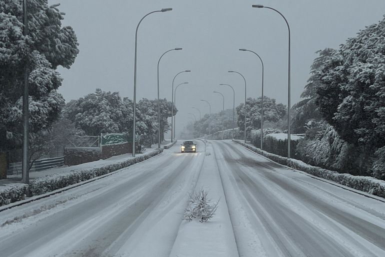 portugal-4-1769620586 A car drives on a snowy road as storm Kristin hits several parts of Spain and Portugal, in Galapagar, on the outskirts of Madrid, Spain, January 28, 2026. REUTERS/Silvio Castellanos