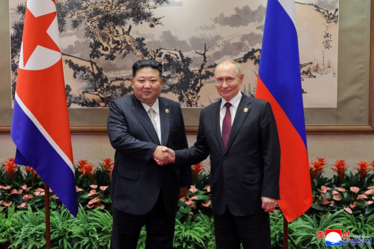 North Korean leader Kim Jong Un shakes hands with Russian President Vladimir Putin as they attend a ceremony to mark the 80th anniversary of the end of World War Two, in Beijing, China, in this picture released by the Korean Central News Agency on September 4, 2025. KCNA via REUTERS ATTENTION EDITORS - THIS IMAGE WAS PROVIDED BY A THIRD PARTY. REUTERS IS UNABLE TO INDEPENDENTLY VERIFY THIS IMAGE. NO THIRD PARTY SALES. SOUTH KOREA OUT. NO COMMERCIAL OR EDITORIAL SALES IN SOUTH KOREA.