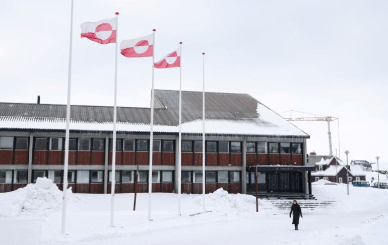 reuters_6965d1e3-1768280547-1 FILE PHOTO: A woman walks past Greenland's parliament Inatsisartut in Nuuk, Greenland, March 28, 2025. REUTERS/Leonhard Foeger/File Photo