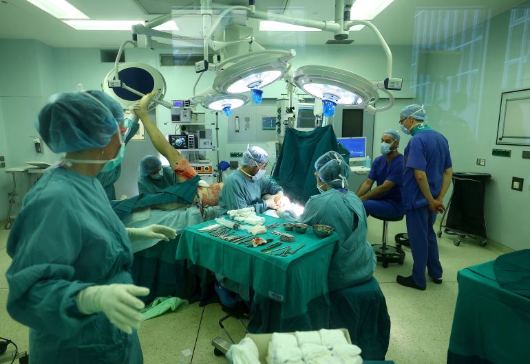 SENSITIVE MATERIAL. THIS IMAGE MAY OFFEND OR DISTURB ATTENTION EDITORS - the patient in this photograph is not a victim of the fire at the "Le Constellation" bar in Switzerland. A patient with severe burning injuries undergoes an exemplary surgery for plastic skin graft by a team of plastic reconstructive surgeons at the Clinic for severe burning at UKH Unfallkrankenhaus Berlin, Germany, January 5, 2026. Accident hospital UKH Unfallkrankenhaus Berlin treats a patient following a fire and explosion during a New Year’s Eve party at the "Le Constellation" bar, in which people died and others were injured, in the upscale ski resort of Crans‑Montana in southwestern Switzerland. REUTERS/Lisi Niesner