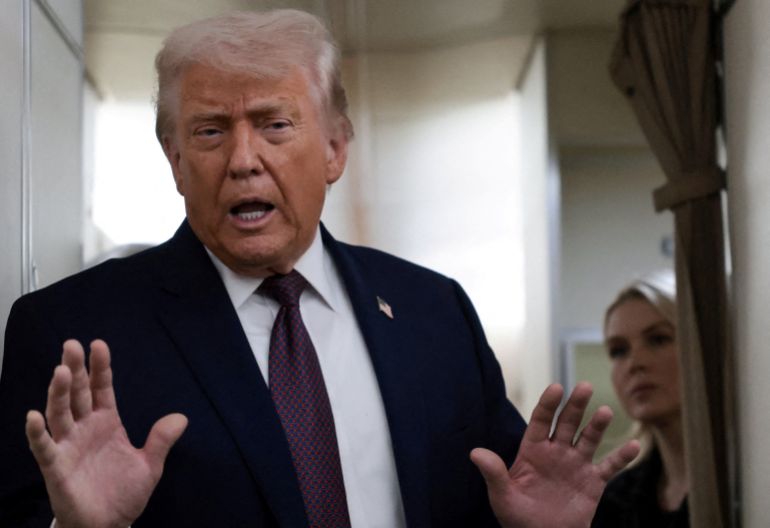 reuters_69763612-1769354770-1 FILE PHOTO: U.S. President Donald Trump speaks to reporters over the North Atlantic as he returns to Washington from the World Economic Forum in Davos, Switzerland, aboard Air Force One, U.S., January 22, 2026. REUTERS/Jonathan Ernst/File Photo