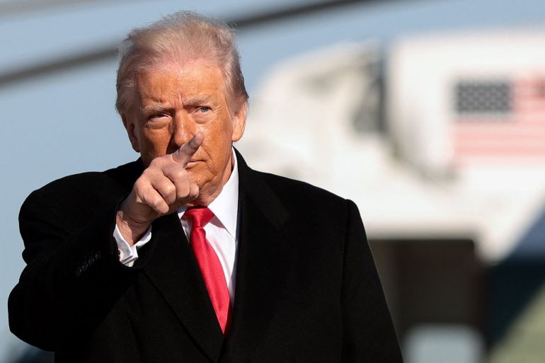 U.S. President Donald Trump gestures, before boarding Air Force One en route to Detroit, Michigan, at Joint Base Andrews, Maryland, U.S., January 13, 2026. REUTERS/Evelyn Hockstein