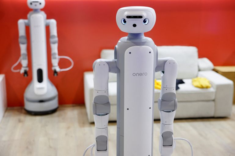 SwitchBots Onero H1, which uses cameras, articulated arms and an on-device AI model to perform household tasks, is on display at the annual Consumer Electronics Show (CES) in Las Vegas, Nevada, on January 6, 2026. (Photo by Caroline Brehman / AFP)