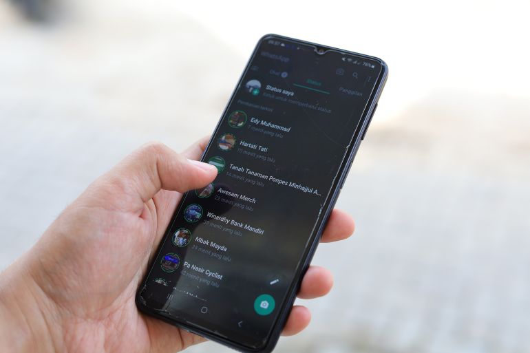 Malang, Indonesia - July 4, 2023 : male hand holding smartphone with whatsapp application on black android smartphone screen.; Shutterstock ID 2326536427; purchase_order: aj; job: ; client: ; other: