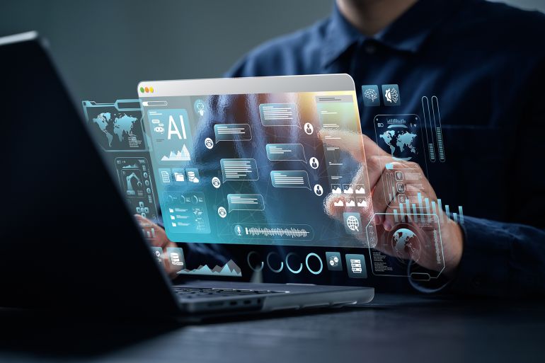 AI content creation tools: Man uses laptop with AI assistant for graphic design, translation, chatbot, image creation, coding, and advertising.; Shutterstock ID 2588166011; purchase_order: aj; job: ; client: ; other: