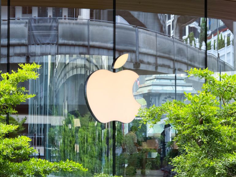 shutterstock_2656992989-1765094915 Bangkok, Thailand - June 21, 2025: Exterior Apple logo at Central World Apple Store reflecting lush greenery and architecture. High quality photo