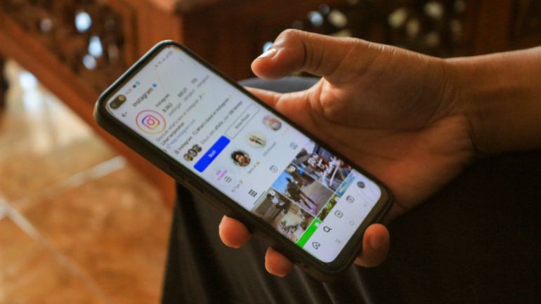 Kediri, Indonesia - May 18, 2025: A man holds a smartphone with his Instagram profile on the screen. Instagram is a social networking and media-sharing service owned by Meta Platforms. social media.; Shutterstock ID 2690275249; purchase_order: ا; job: ; client: ; other: