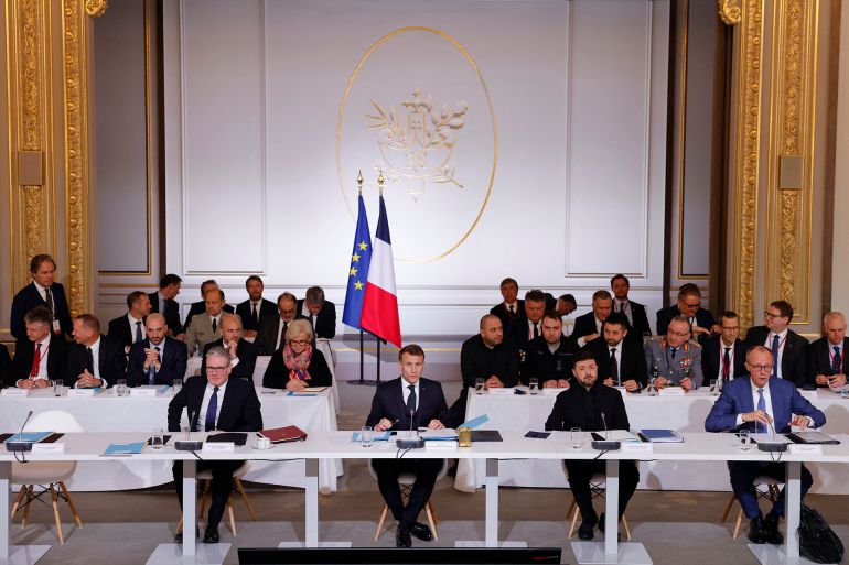 uk-1-1767722571 (LtoR) British Prime Minister Keir Starmer, French President Emmanuel Macron, Ukrainian President Volodymyr Zelensky and German Chancellor Friedrich Merz take part in the Coalition of the Willing meeting in Paris, at the Elysee Palace on January 6, 2026. The summit of the group of Ukraine supporters dubbed the "Coalition of the Willing" is the latest of several meetings planned for the new year as diplomatic efforts to end Europe's deadliest conflict since World War II have gained pace in recent weeks. (Photo by Yoan VALAT / POOL / AFP)