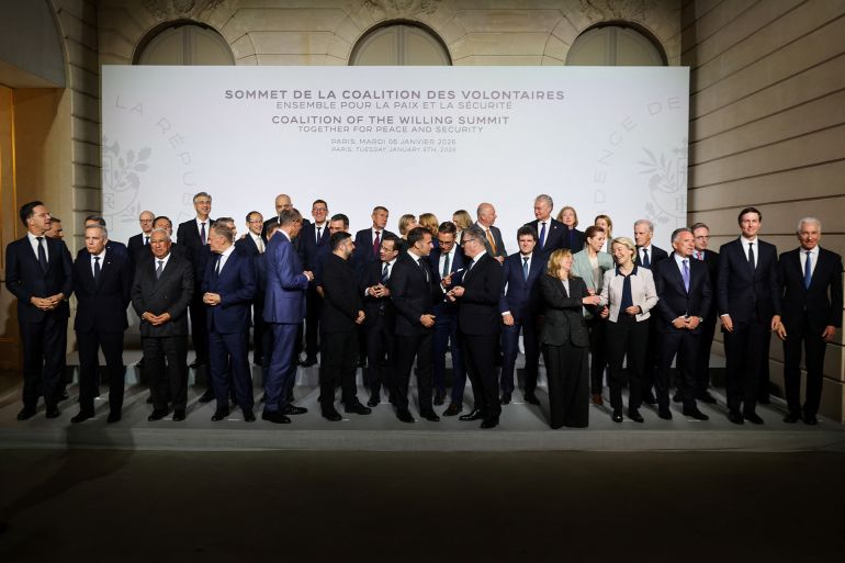 uk-2-1767722555 NATO Secretary General Mark Rutte, Canada's Prime Minister Mark Carney, European (front row from L) Council President Antonio Costa, Poland's Prime Minister Donald Tusk, Germany's Chancellor Friedrich Merz, Ukraine's President Volodymyr Zelensky, Sweden's Prime Minister Ulf Kristersson, France's President Emmanuel Macron, Finland's President Alexander Stubb, Britain's Prime Minister Keir Starmer, Romania's President Nicusor Dan, Italy's Prime Minister Giorgia Meloni, European Commission President Ursula Von der LeyenUS Special Envoy Steve Witkoff, US President's son-in-law and businessman Jared Kushner and US Ambassador to France Charles Kushner react as they arrive to pose for a family photo at the Elysee Palace in Paris, on January 6, 2026, on the sideline of the Coalition of the Willing summit on security guarantees for Ukraine. The summit of the group of Ukraine supporters dubbed the "Coalition of the Willing" is the latest of several meetings planned for the new year as diplomatic efforts to end Europe's deadliest conflict since World War II have gained pace in recent weeks. (Photo by Ludovic MARIN / POOL / AFP)