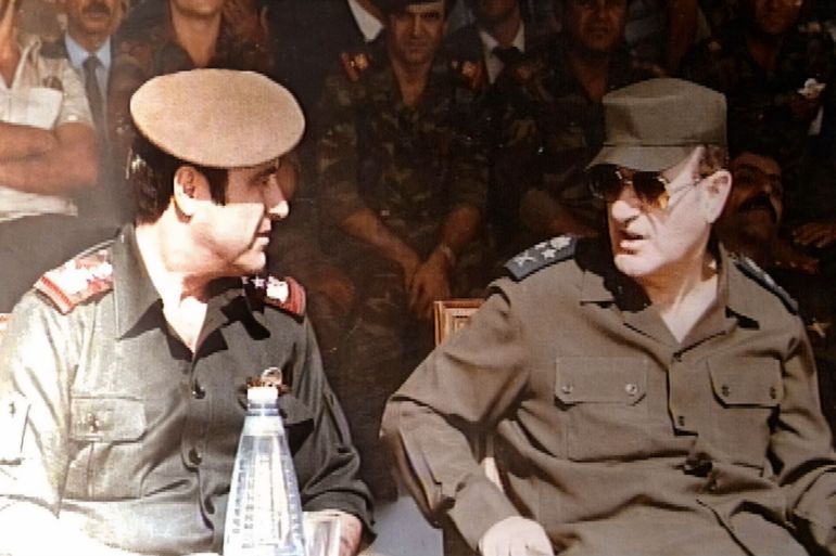 untid-2-1707200897-1 Picture taken in 1984 shows late Syrian president Hafez al-Assad (R) with his youngest brother Rifaat (L) at a military ceremony in Damascus. The estranged and banished brother, Rifaat, announced 12 June 2000 that he considers himself the legitimate successor to the presidency of Syria. The statement represents a direct challenge to the right of Bashar al-Assad, the late president's son and designated heir, to take the post. (Photo by Handout / AFP) / XGTY / == RESTRICTED TO EDITORIAL USE - MANDATORY CREDIT "AFP PHOTO / HO " - NO MARKETING NO ADVERTISING CAMPAIGNS - DISTRIBUTED AS A SERVICE TO CLIENTS == - XGTY / == RESTRICTED TO EDITORIAL USE - MANDATORY CREDIT "AFP PHOTO / HO " - NO MARKETING NO ADVERTISING CAMPAIGNS - DISTRIBUTED AS A SERVICE TO CLIENTS == / BEST QUALITY AVAILABLE
