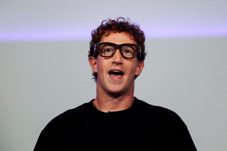Meta CEO Mark Zuckerberg wears the Meta Ray-Ban Display glasses, as he delivers a speech presenting the new line of smart glasses, during the Meta Connect event at the company's headquarters in Menlo Park, California, U.S., September 17, 2025. REUTERS/Carlos Barria