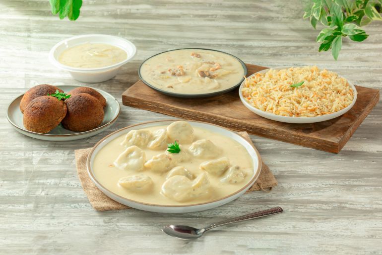 Shish Barak or Kishk, Syrian Arabic dish with yogurt sauce, served with kibbeh and rice; Shutterstock ID 2644768273; purchase_order: d; job: ; client: ; other: