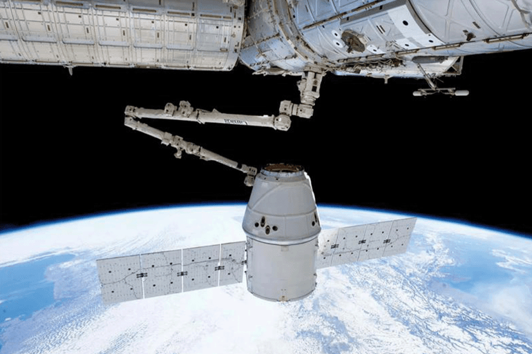 Dragon capsule by SpaceX docking with the International Space Station on May 25, 2012—the first time a commercial spacecraft Credit: SpaceX/NASA