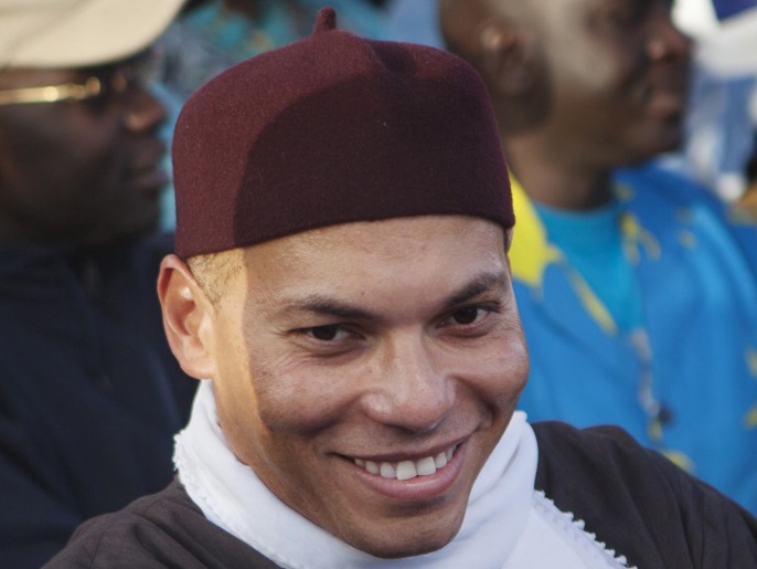 a2615f06-a396-4a7c-bb24-89dff225c36a karim wade (c), son of senegal's former president abdoulaye wade, attends a rally of his father's political party parti democratique senegalais (pds) in dakar, in this file picture taken december 6, 2012. reuters/joe penney/files