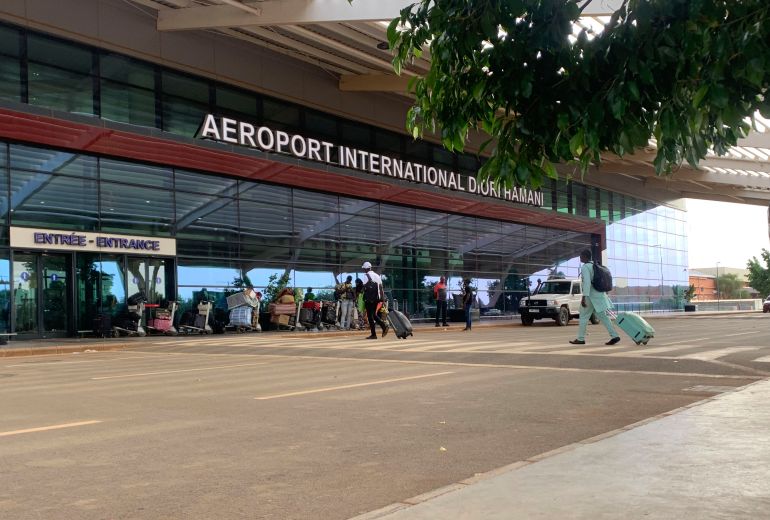(FILES) Passengers arrive at the Diori Hamani International airport in Niamey on September 22, 2023.