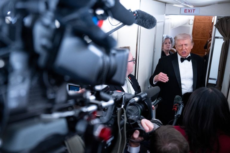 afp_6984f9bc4fc3-1770322364 US President Donald Trump speaks to members of the media aboard Air Force One as he travels from Washington, DC to West Palm Beach, Florida, on January 31, 2026.