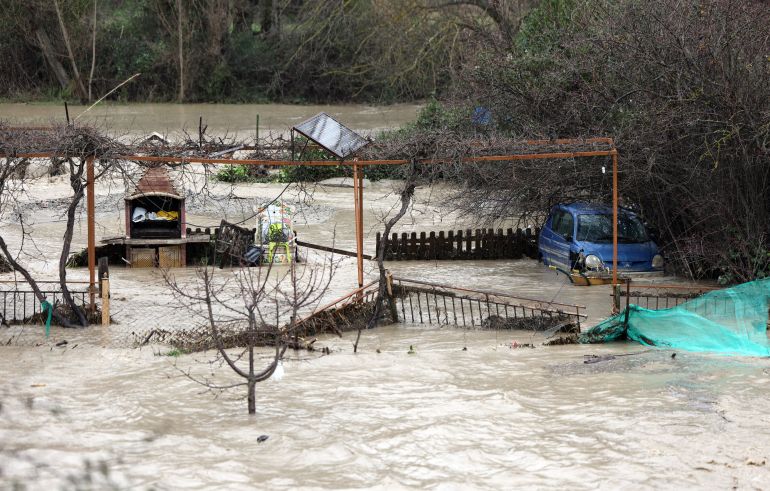 TOPSHOT - Floodwaters from Aguas Blancas river flow through the village of Quentar, southern Spain amid Storm Leonardo, on February 5, 2026.