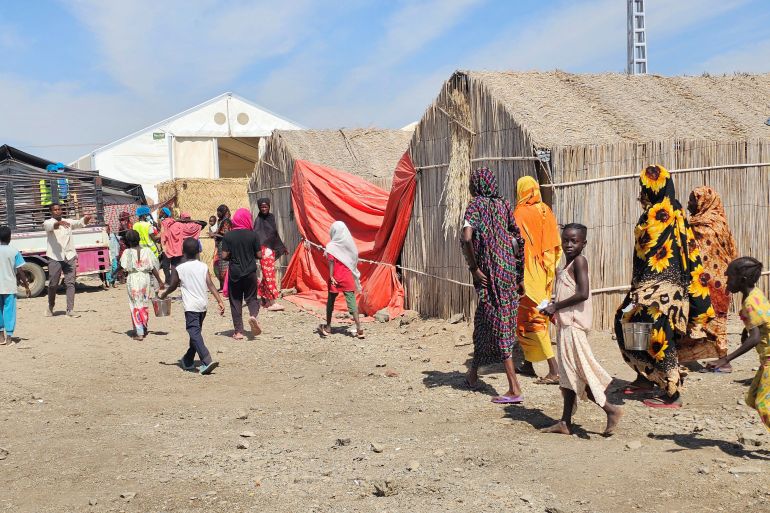 afp_6987b73f27ea-1770501951 Displaced Sudanese gather near a food distribution point at the Abu al-Naga displacement camp in the Gedaref State, some 420km east of the capital Khartoum on February 6, 2026.